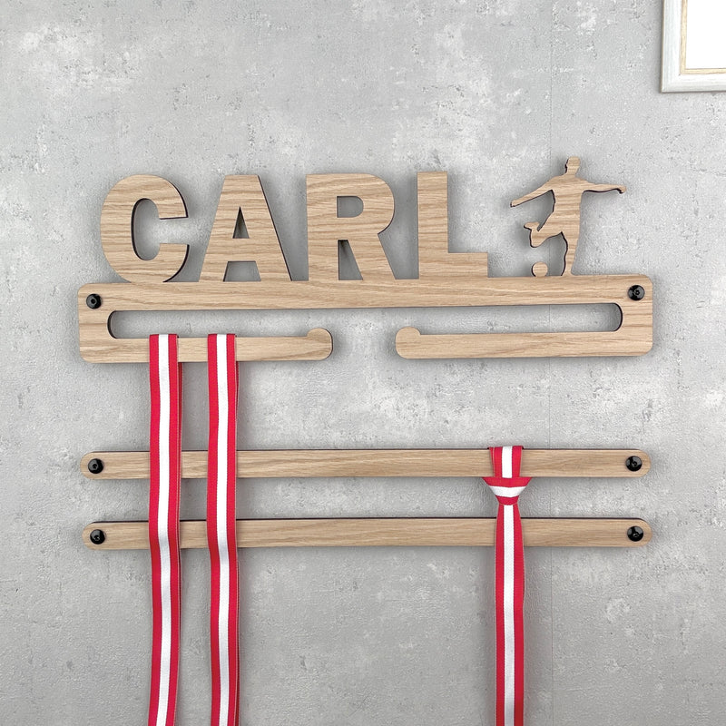 Medal hanger with trophy and own name