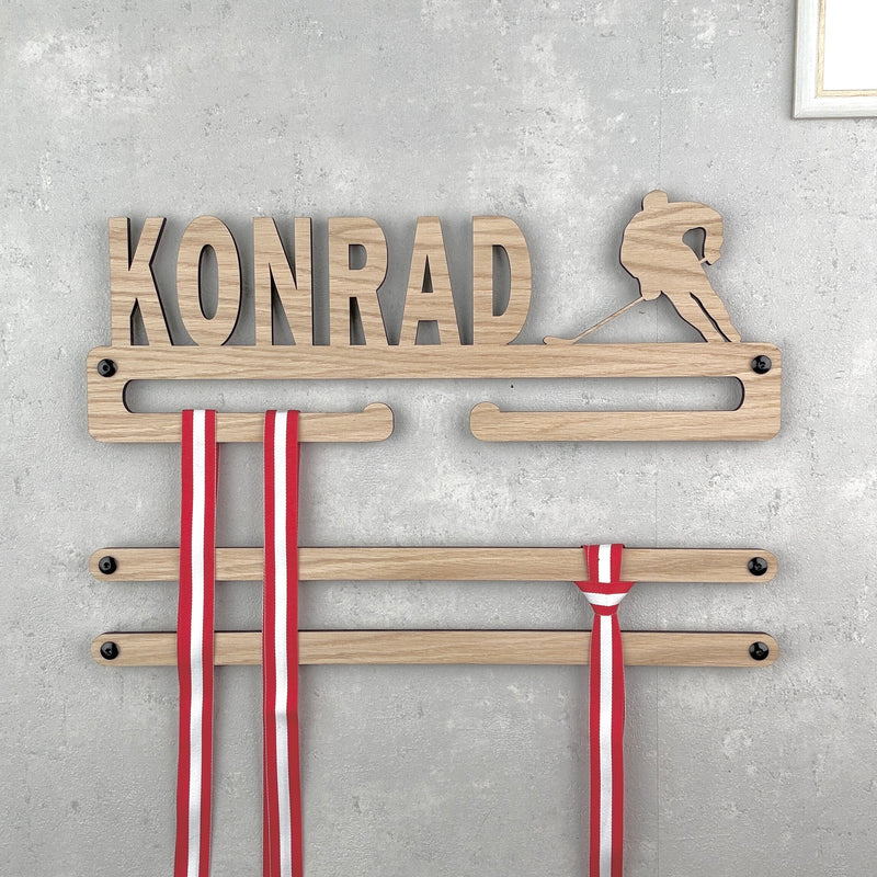 Medal hanger with hockey player and own name