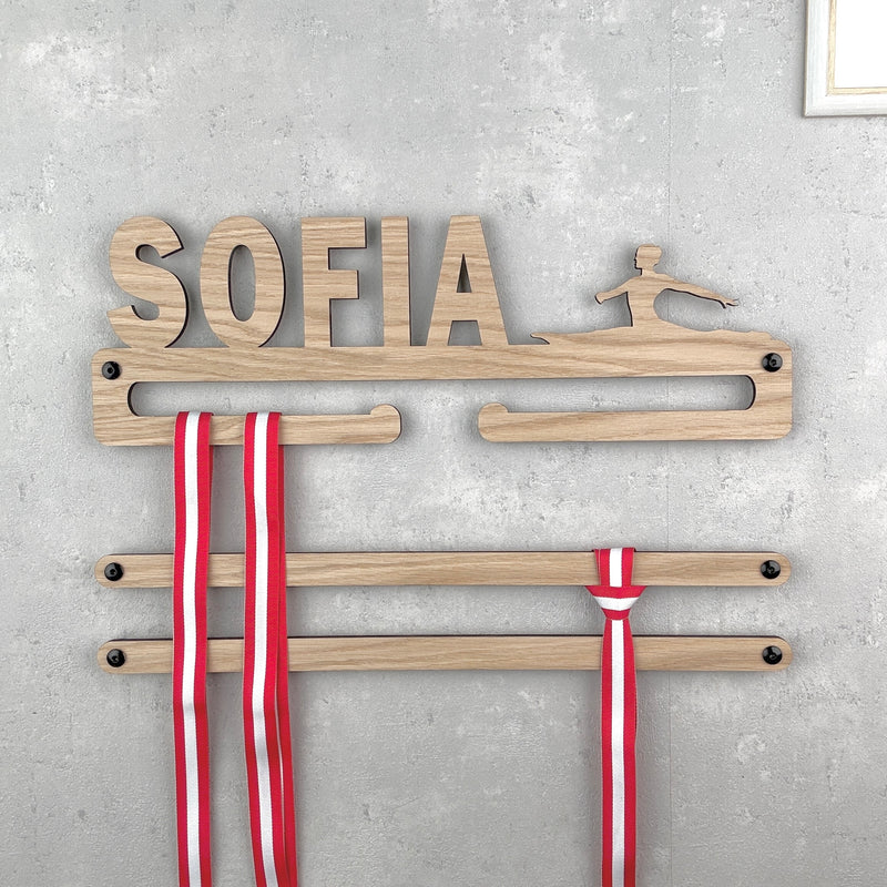 Medal hanger with girl in splits and own name